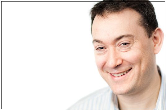 Businessman, corporate headshot with a single off-camera flash, London