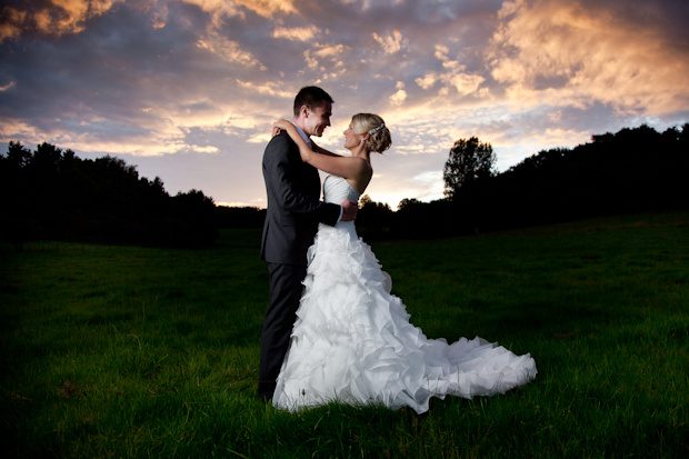 Rebecca and Edwin under a dramatic sunset sky, portrait by Mat Smith Photography, Wonersh, Surrey