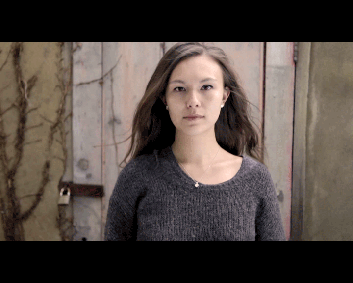 Annika Wong by a door with moving hair, cinegraph portrait by Mat Smith Photography