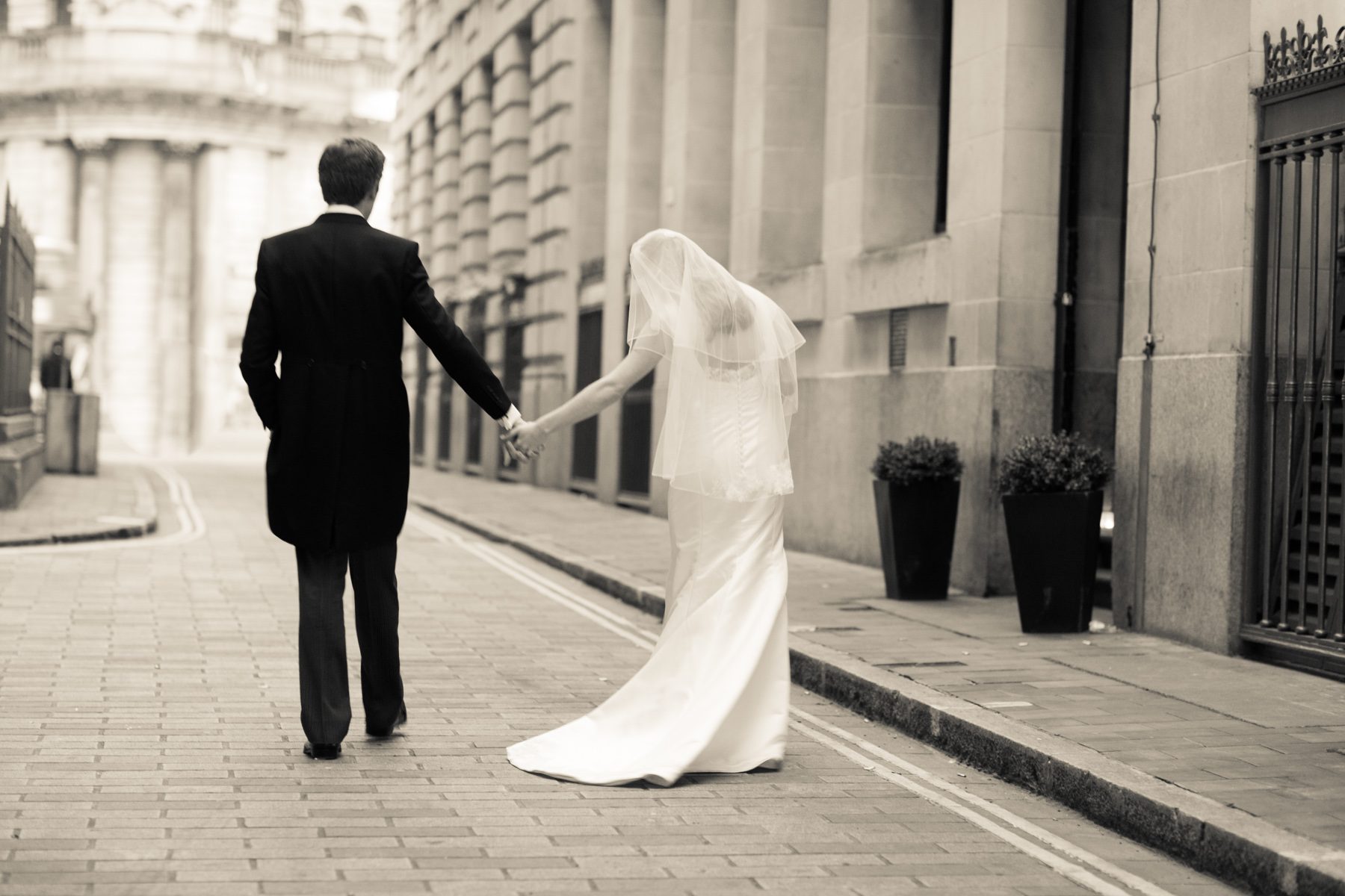 Kathryn and Phil, bride and groom portrait by Mat Smith Photography at the Royal Exchange, London