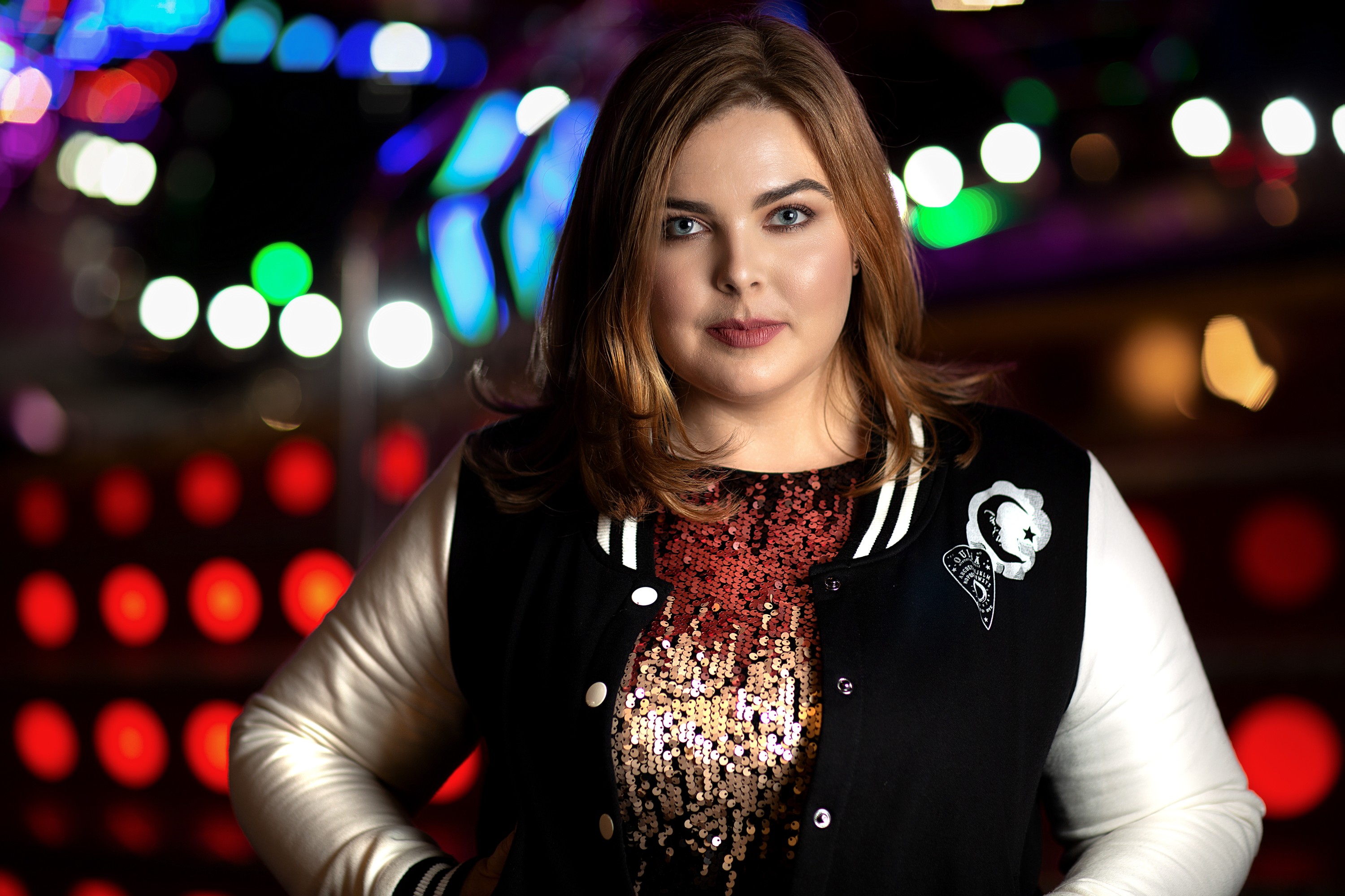 Alwyn Hamilton, New York Times bestselling author, portrait by Mat Smith Photography at a funfair in Chiswick