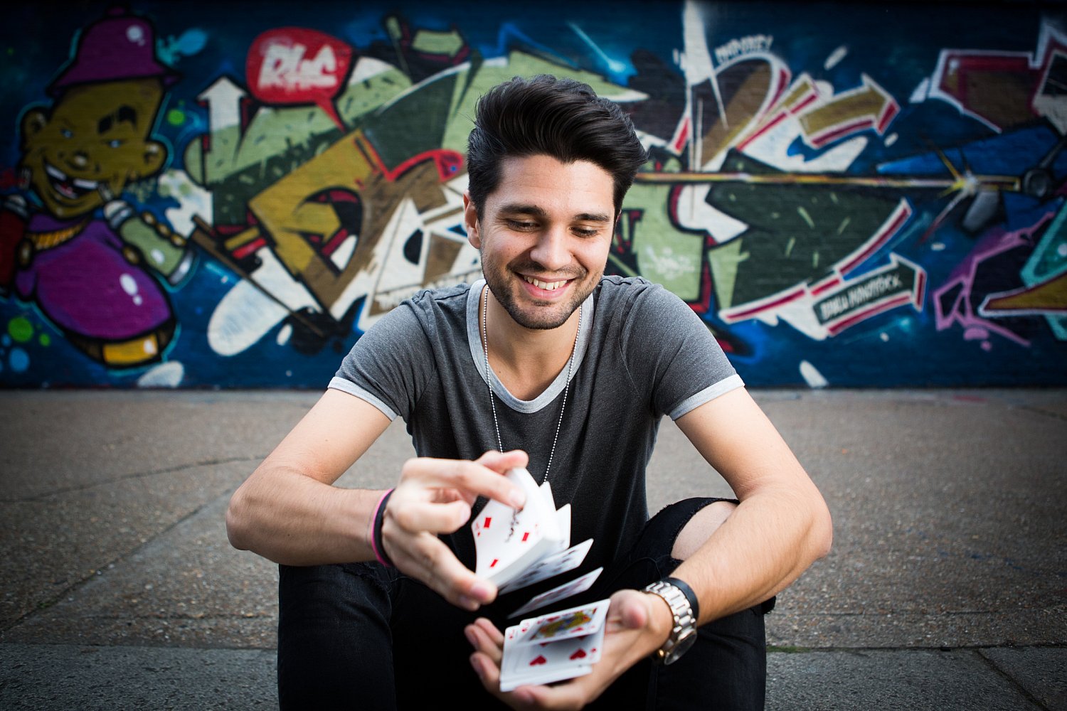 Sam Dixon (Maddox Magic), Britain's Got Talent semi-finalist magician, with a deck of cards, portrait by Mat Smith Photography, East London
