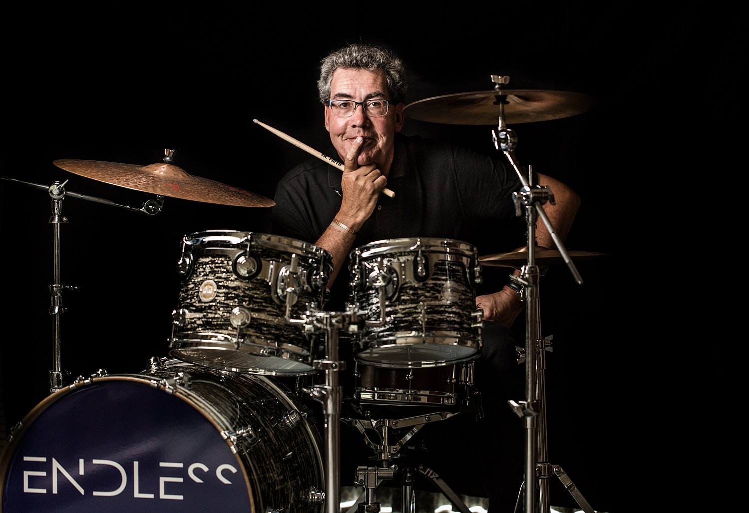 Drummer at his drum kit